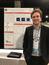 Richard Feder stands in front of this poster at 2018 AAS Meeting