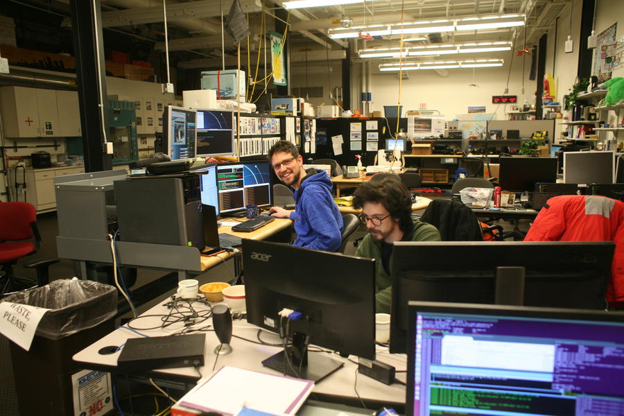 SPT winter-over scientists Daniel and Andrew in control of the South Pole Telescope during EHT observations.