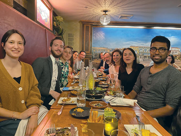 Weatherhead Scholars Program affiliates pose at a restaurant table