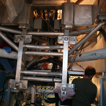 Dan working on the South Pole Telescope EHT electronics inside the telescope receiver cabin.