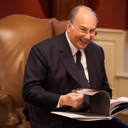 Image of His Highness the Aga Khan with photo album