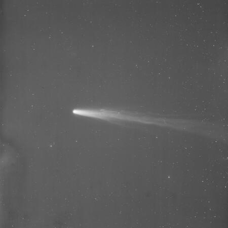 Glass plate B41215 shows Halleys Comet in 1910. This is a glass plate positive, meaning Halley's Comet appears as a bright white streak across the dark sky.