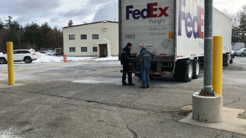 FedEx truck delivering crates with EHT data from SPT