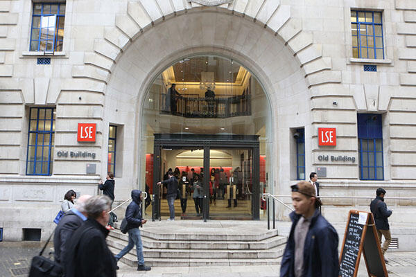 Exterior of LSE Old Building with students passing by
