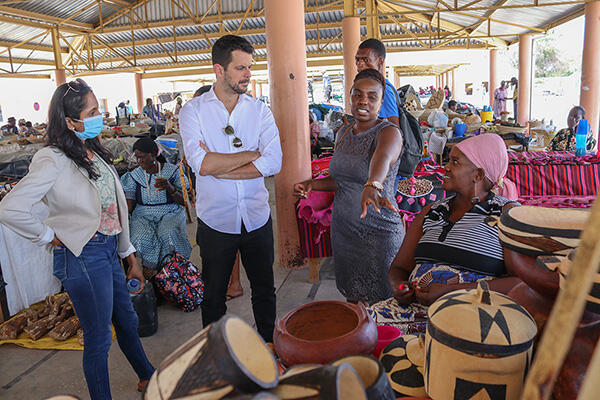 Growth Lab researchers meet with Namibian locals in a marketplace