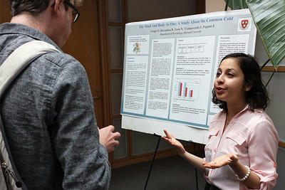 people talking poster session event