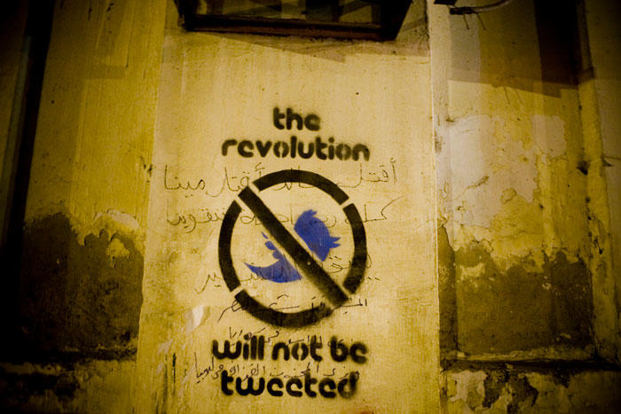 Image of graffiti with the message the revolution will not be tweeted
