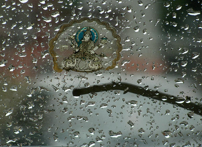 Image of water droplets on a taxi window.