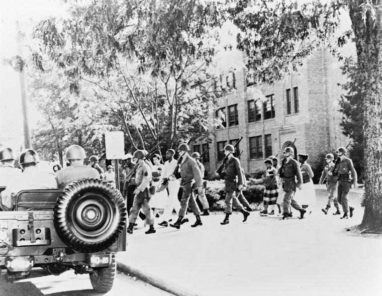 Image of National Guard escorting students
