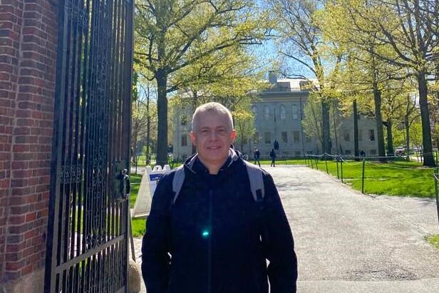 Stefano Iacus standing at Harvard's Johnston Gate