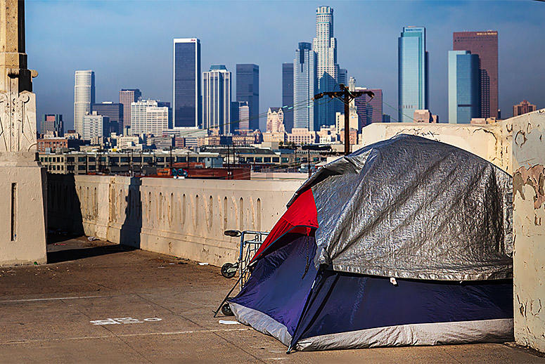 A tent where one of the 44,000 homeless people in Los Angeles County sleeps is within view of the city's financial center. (Source: Getty Images)