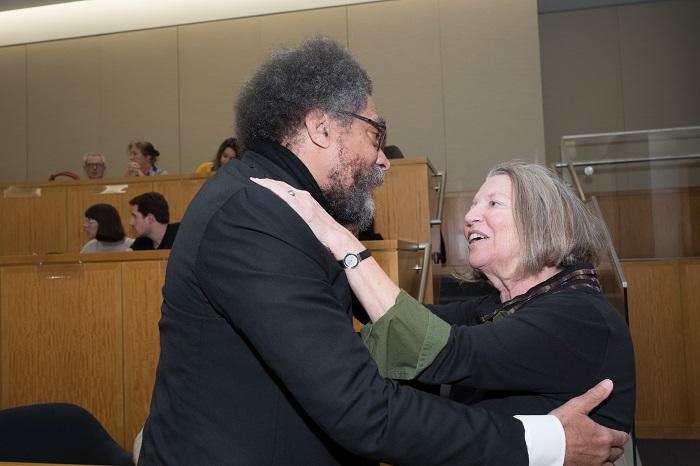 Image of Nancy Fraser hugging Cornel West