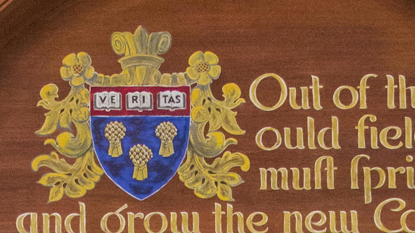 Color image of la Rose shield with three sheaves of wheat and part of quote by Coke