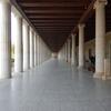 An ample corridor surrounded by ancient Greek style columns in Athens's Stoa of Attalos.