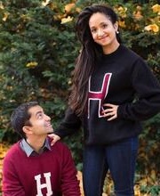 photo of Irfan on the left and Kirin Gupta on the right. Both are outside with fall leaves as a backdrop wearing Harvard sweaters